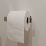Vessapaperirulla telineessä vessassa.